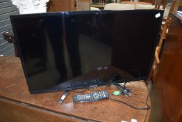 A Polaroid 32' TV, with remote