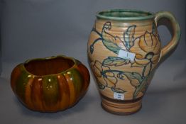 A 1930s Royal Cauldon jug, having tube lined poppy design in the manner of Charlotte Rhead,