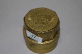 An antique brass carriage or cart wheel hub nut,' T Ashley coach builder, Bolton by Bowland', having