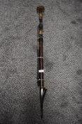 An antique continental tobacco pipe having wood shaft and horn banding.