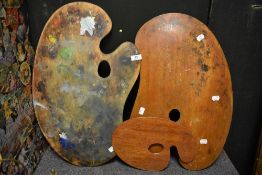 Three wooden artists palettes.