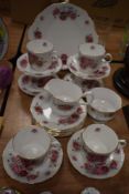 A selection of Royal Minster tea wares, having bold rose transfer pattern.