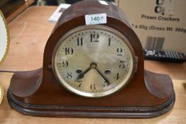An early 20th century hump back mantel clock.