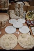 A selection of 19th century parion ware plaques and figurines having classical design, inclduing