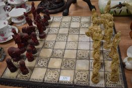 An oriental style modern chess board and pieces.