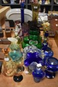 A large selection of mixed vintage coloured glass, to include mid century ruby wine goblets, blue