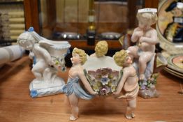 Three 20th century ceramics, to include double stemmed bud vase with cherub child playing