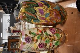 Two mid century vases, one having raised roses with lustre ground, the other with bright bird and