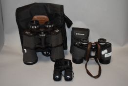 Three pairs of binoculars, including Frank Nipole and Halina discovery.