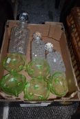 Six Art Deco green glass fruit bowls having etched design, and three cut glass decanters, AF.