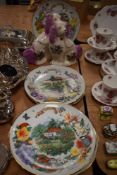 Eight Reco display plates and two K.H pottery Staffordshire dogs.