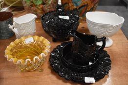 A collection of Victorian milk glass and black glass, including lidded bowl, jug and orange mid