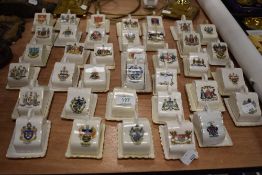 A collection of vintage crested ware in the form of miniature cheese dishes, Blackpool, Brighton,