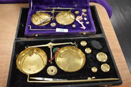 Two sets of antique/vintage brass jewellery scales.