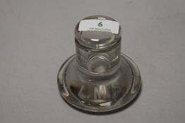 A pressed glass ink well, around 1930s, etched LMS to foot, of railway interest to London, Midland