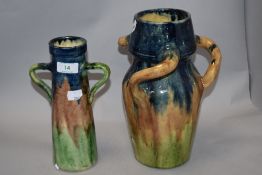 Two mid century studio pottery vases in the manner of Brannam of Barnstable, having blue, green