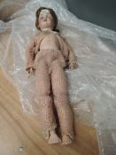An early 20th century Armand Marseille/Simon Halbig style bisque headed Doll having sleep eyes, open