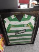 A framed 2009/2010 Celtic Home Shirt bearing signatures from the squad at the time including
