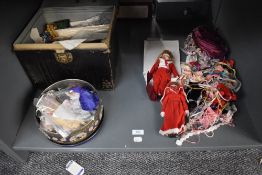 A shelf of vintage Dolls, Accesories, Clothing, Spare Parts also a vintage small tin trunk