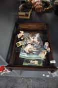 A vintage wooden and glazed display case containing modern miniature Bonnie Bears, similar resin