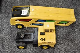 A Mighty Tonka pressed steel Car Transporter in yellow and black with three red, green and blue