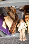 A wooden scale model Sailboat named Abatross along with a felt covered Doll