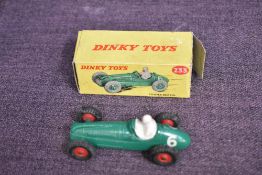 A Dinky diecast, 233 Cooper Bristol in green with racing no 6 and driver present, red hubs, in
