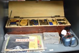 A wooden box of Meccano including Wheels, Pulleys etc, Meccano Electric Motor E20B. Instruction