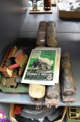 A shelf of 0 gauge including two Hornby style Loco's af, three carriages, track and accessories