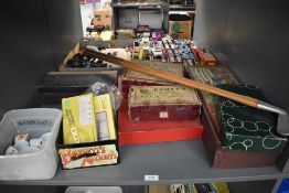 A shelf of vintage Games and Toys including Dometo, Gossima Ping Pong, Table Croquet, Golf Clubs,