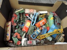 A box of playworn diecasts including early Dinky and Corgi, 1960's tin plate and plastic cars, Lesn