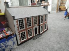 A Georgian style wooden and painted two storey Dolls House, height 70cm, width 80cm, depth 60cm al