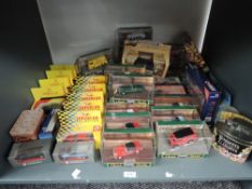 A shelf of modern diecasts including Corgi Classics, Maisto, Shell etc, all boxed approx 40