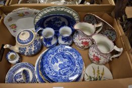 An assortment of ceramics including blue and white plates, jugs and teapots as well as a Wedgwood