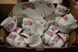 A Czechoslovakian part tea service decorated with pink roses (approx 42 pieces)