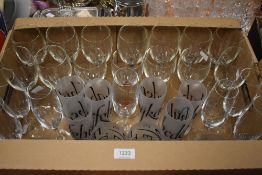 A selection of drinking glasses including ten wine glasses with fluted bowl, seven champagne
