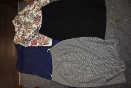 A selection of ladies retro pencil skirts and a floral cotton skirt.