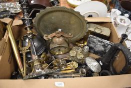 A selection of metal and plated wares including clocks, flatware, horn, lion handles and a myriad of