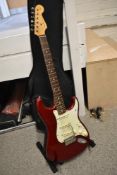 A Mexican Fender Stratocaster electric guitar , circa 2012-2013, serial number MX302002, with soft