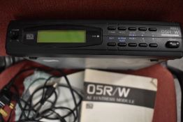 A Korg 05R/W synthesiser module, with instruction manual and power supply