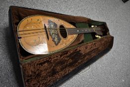 An early 20th Century Neapolitan style mandolin having inlaid decoration throughout with heart motif