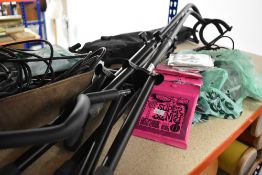 A selection of stands, leads, guitar strings etc