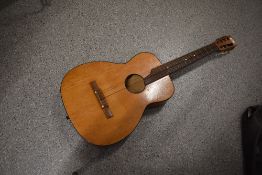 An unbranded classical parlour guitar