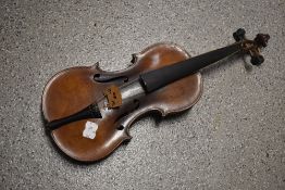 A traditional violin having inch bowed back, label unclear (Stradivarius copy), no case , sold