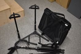 Six guitar stands and a two part music stands (tops only)