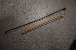 A traditional violin bow and a psaltery or similar bow, neither named