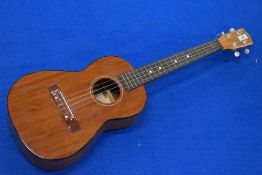 A Franciscan ukulele, possibly baritone model, internal label worn, in vinyl case