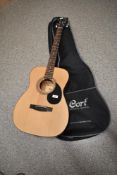 A Cort acoustic guitar , model number AF510, serial number 170215210, with branded soft case