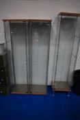 A set of three (two plus one) glazed shop, gallery or similar display cabinets