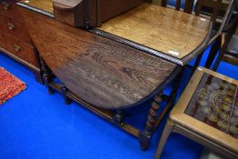 An early to mid 20th Century oak twist gateleg dining table
